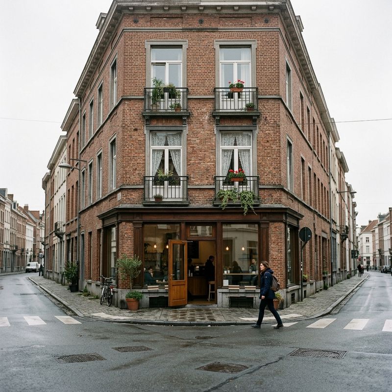 Three-story corner building with a coffee shop below and balconies above